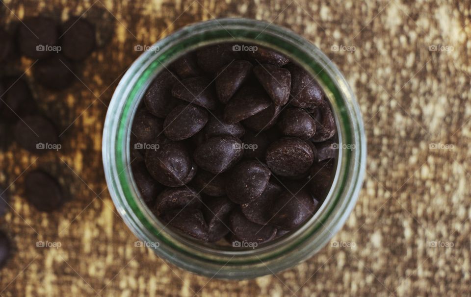 A jar of dark chocolate chips (top view)