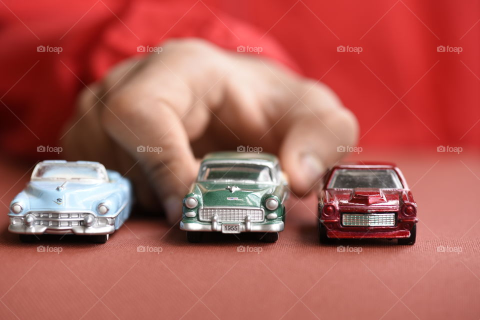 Playing with toy cars.