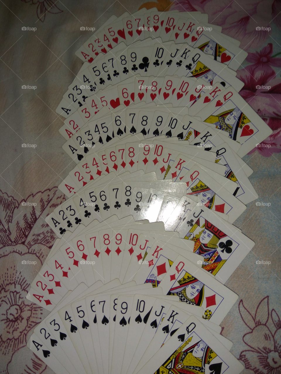 playing cards with many numbers and alphabets