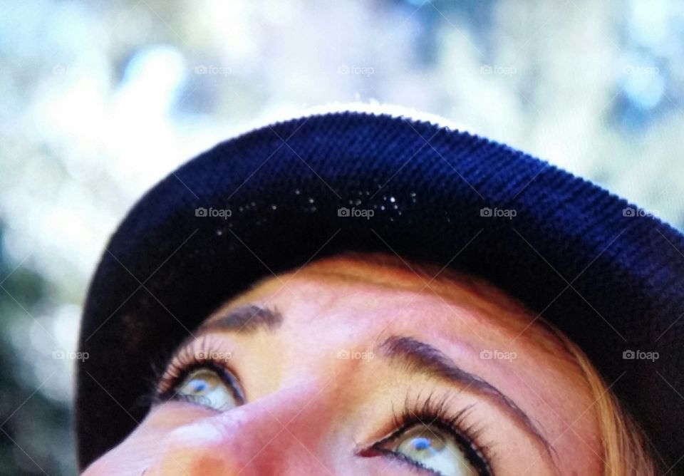 Close-up of woman's eyes looking up