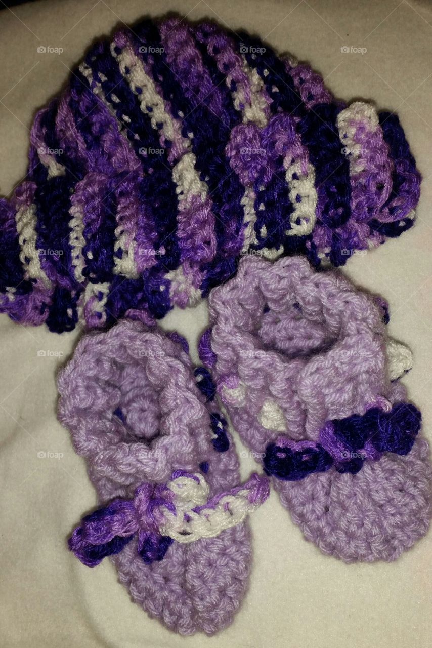 Hand crocheted purple baby booties and matching hat