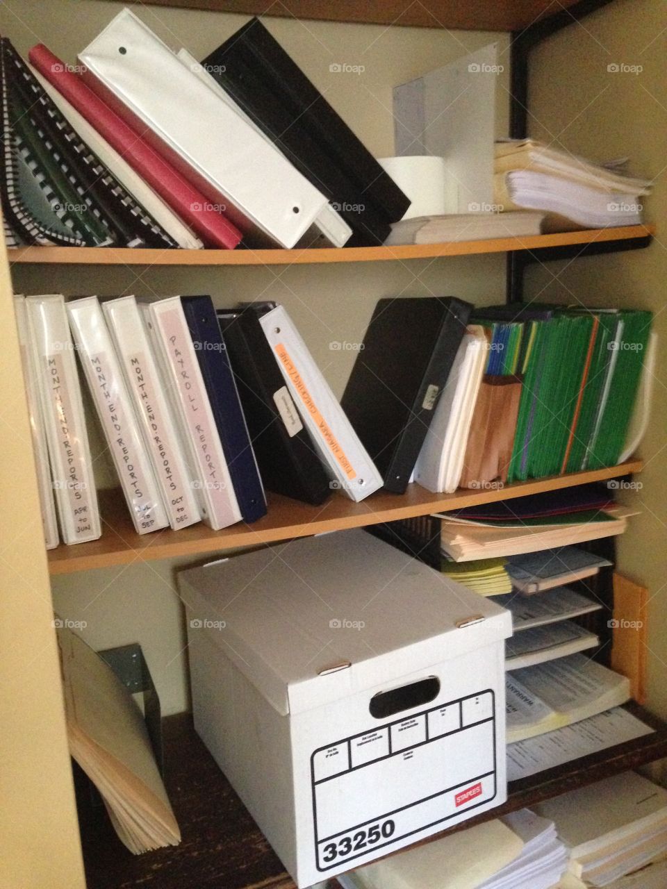 Messy office book shelf 