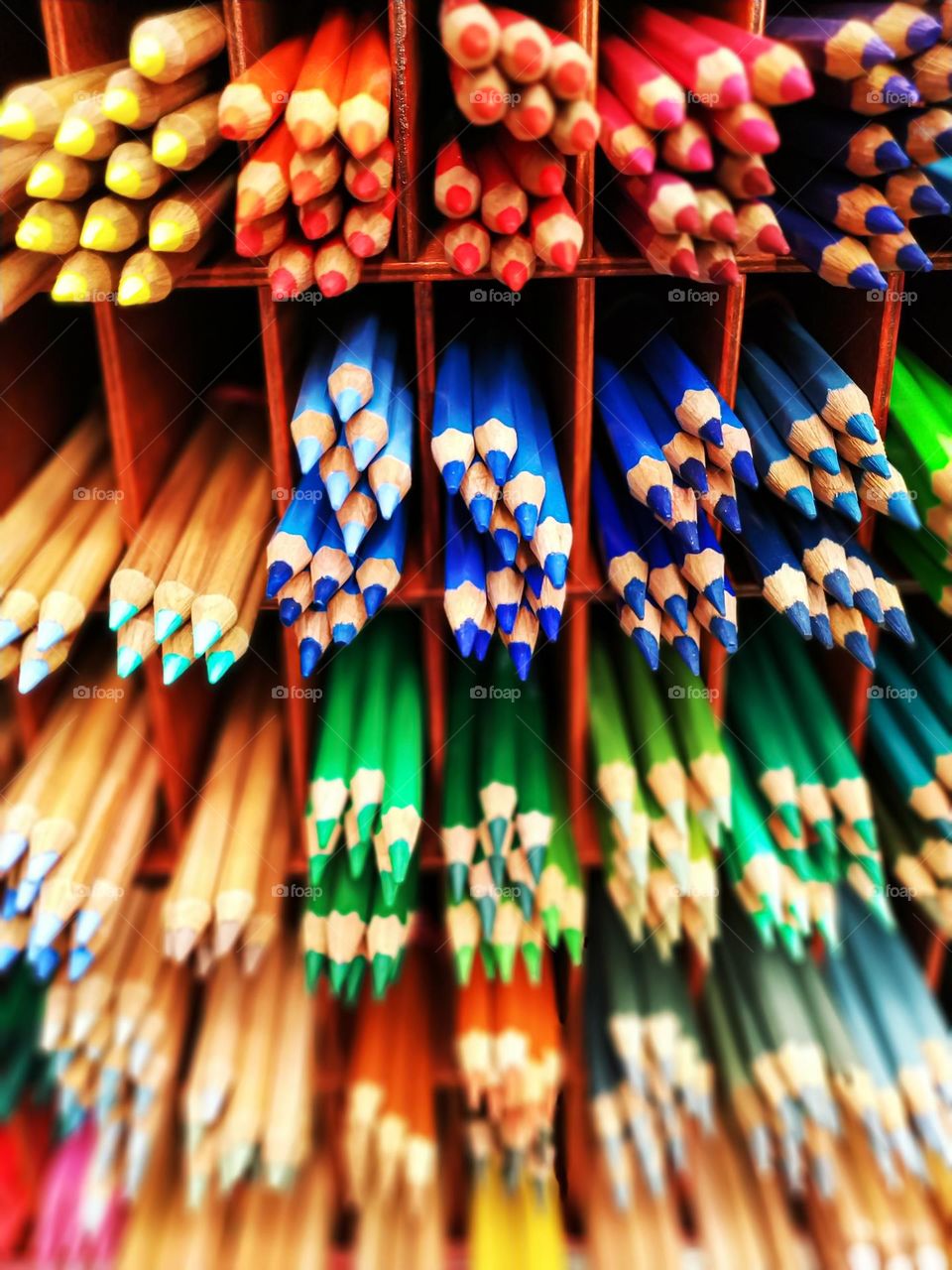 colored pencils are on the shelf in the market