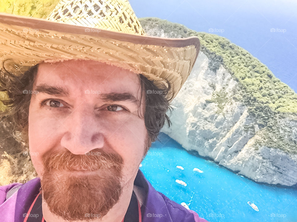 Selfie Smiling Man Portrait On Vacation In Famous Shipwreck Beach At Zakynthos Island Greece
