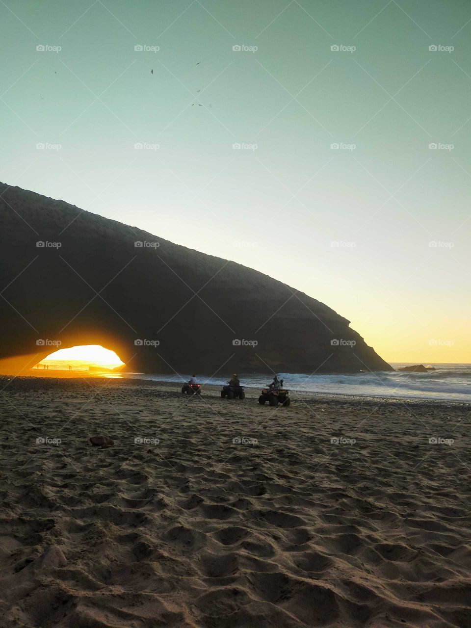 sunset below the arch of Elghzira,Ifni,Morocco
An amazing scene...Sand ,waves and 🌞⛅