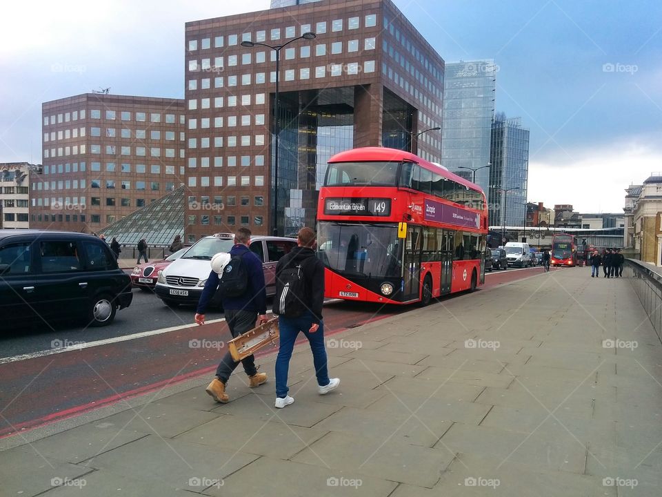 new red bus on London bridge