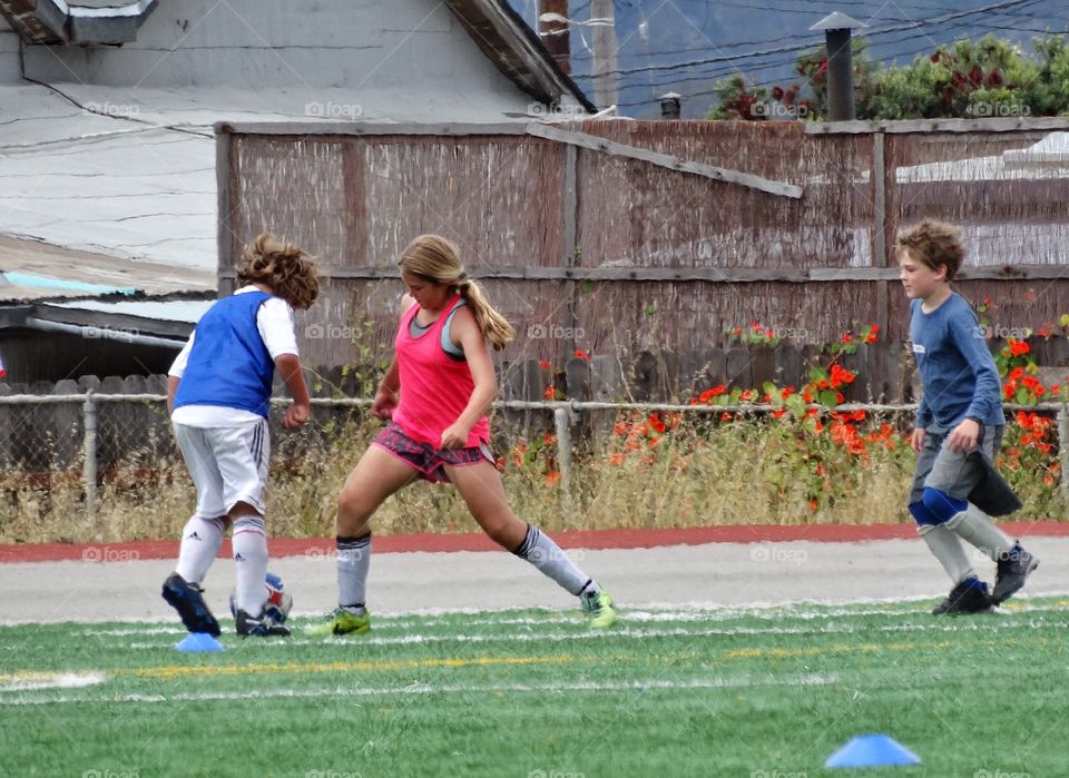 Kids Playing Soccer. Boys And Girls Having A Soccer Scrimmage
