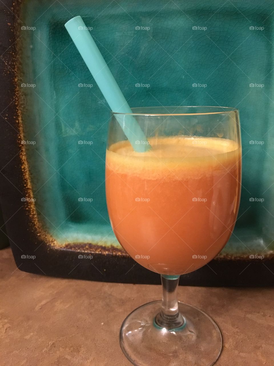 Glass of fresh juices - pineapple, strawberry & coconut