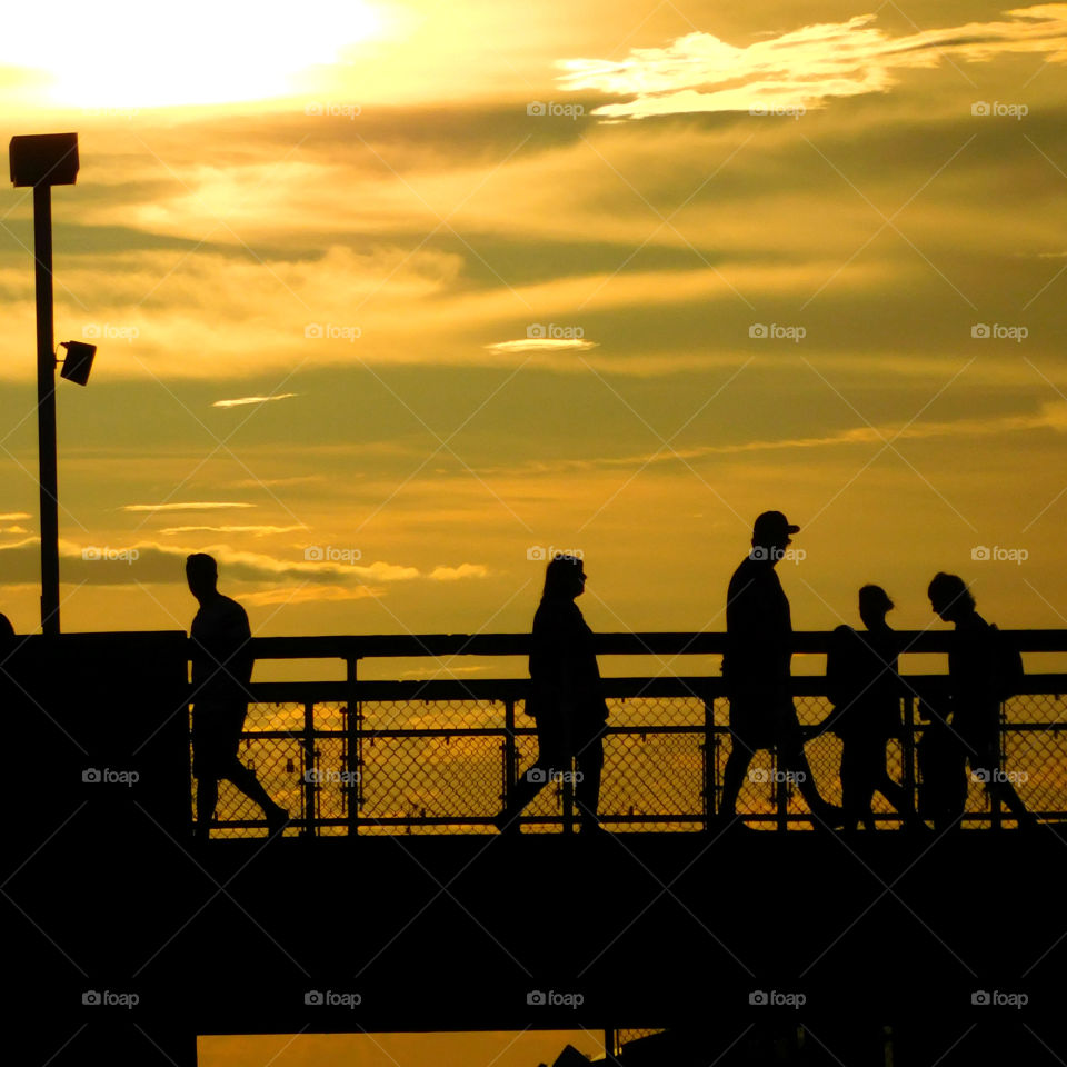 The sun  shone brilliantly and the water in the ocean glittered invitingly! A golden glow spread across the sky as the sun chased the dark clouds away! The sunset is free, so go outside and capture it!