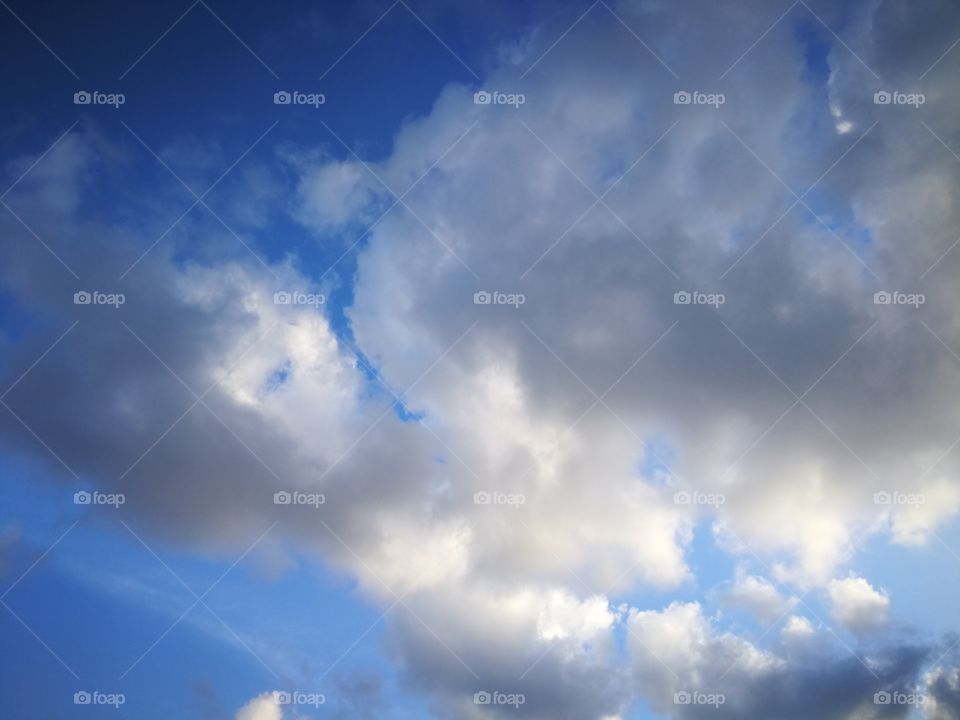 Blue sky with white clouds.