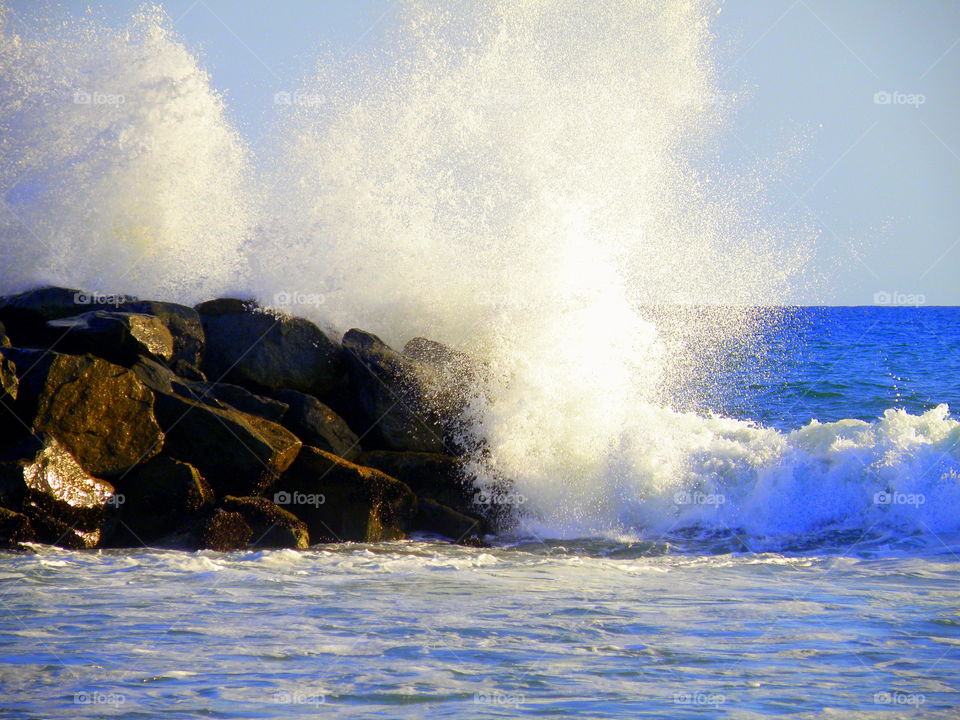 Waves crashing against rock