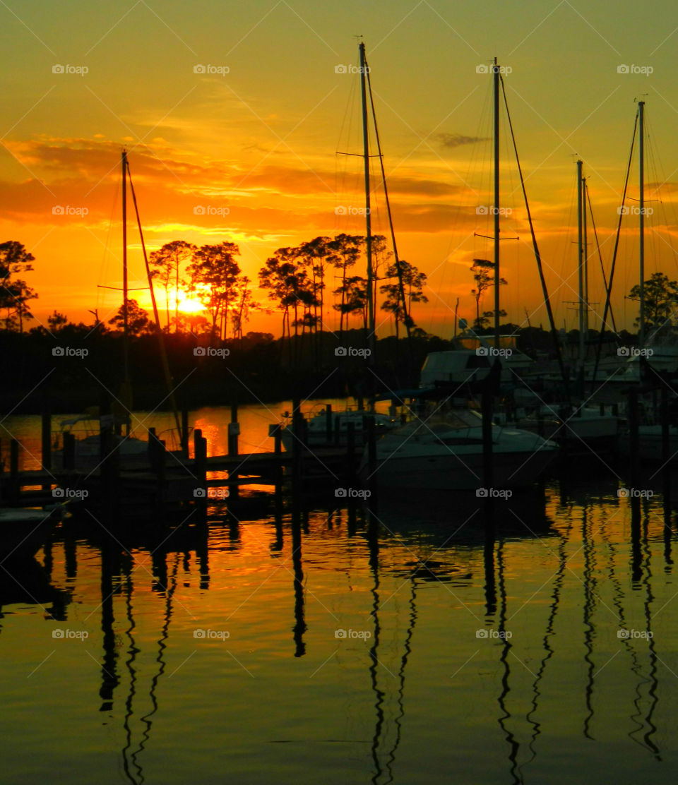 Silhouette of boats at sunset