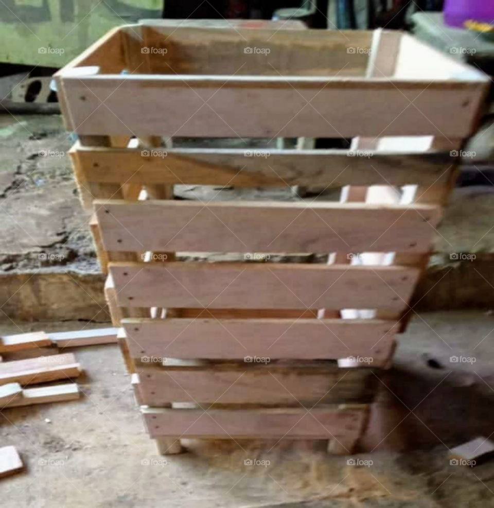 The process of making trash cans from wood.