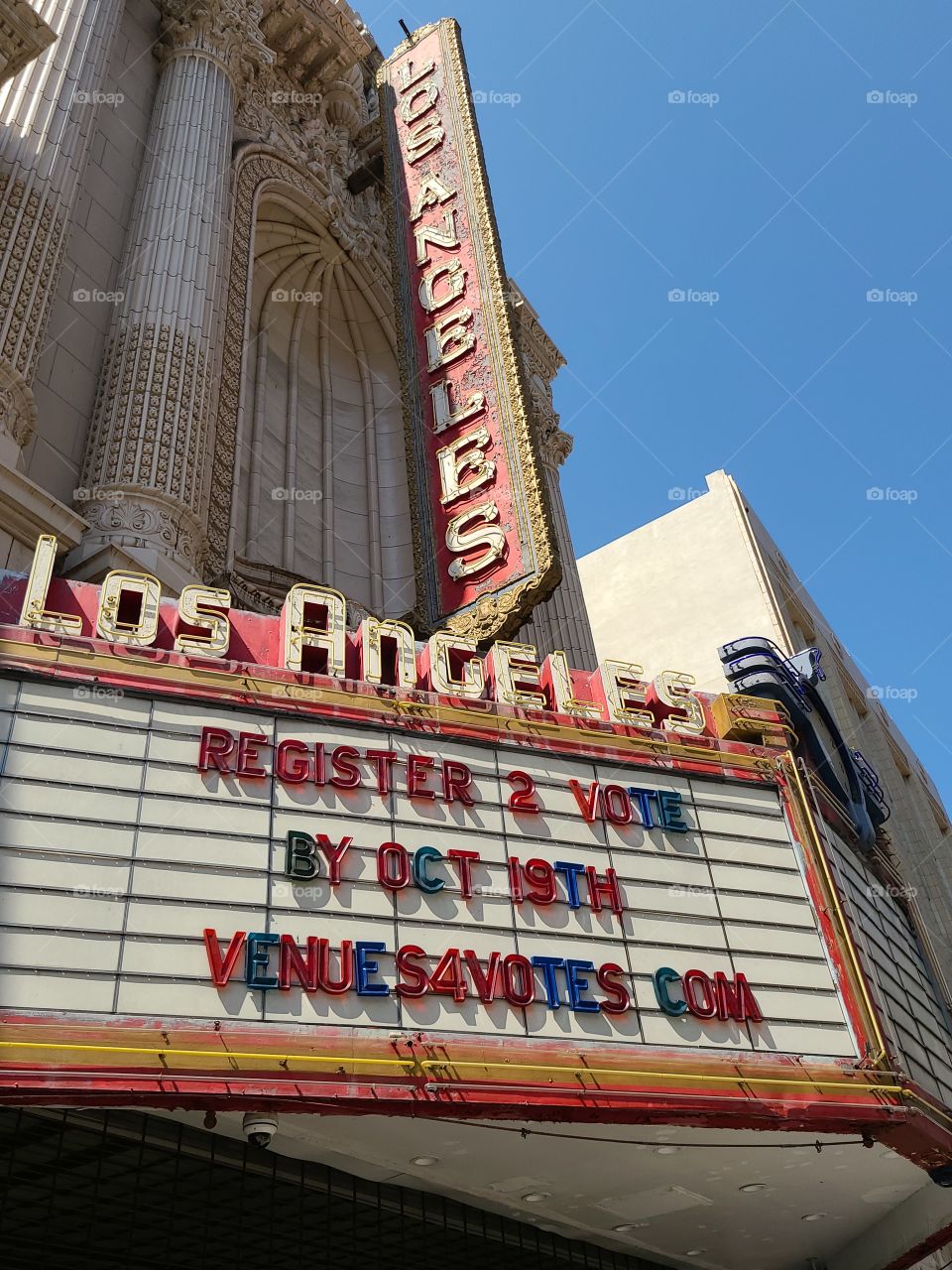 Getting the vote out by theater marquee in Los Angeles.