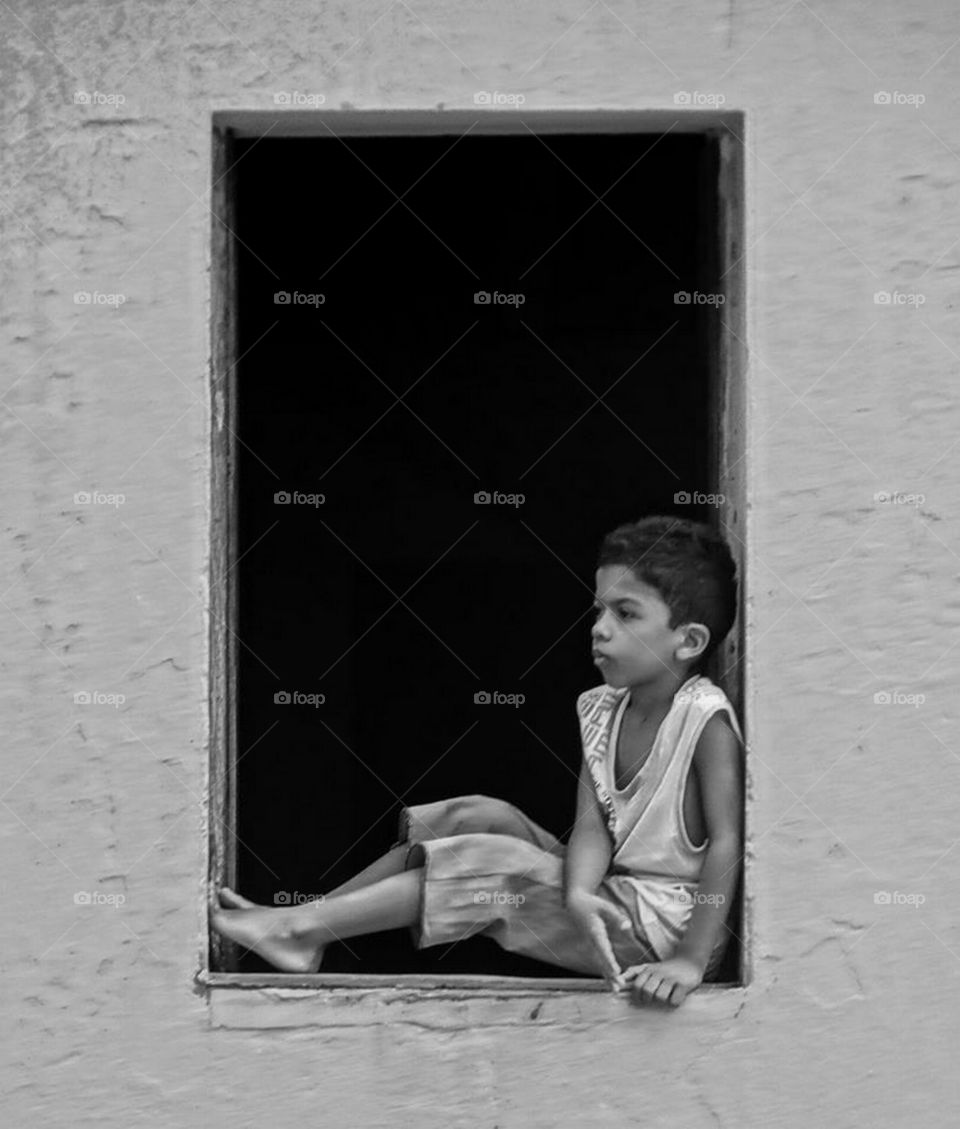A boy staring out of the window