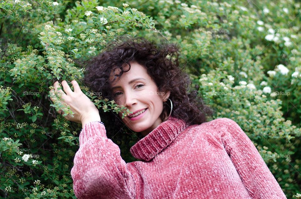 Woman  brunette with beautiful natural hair