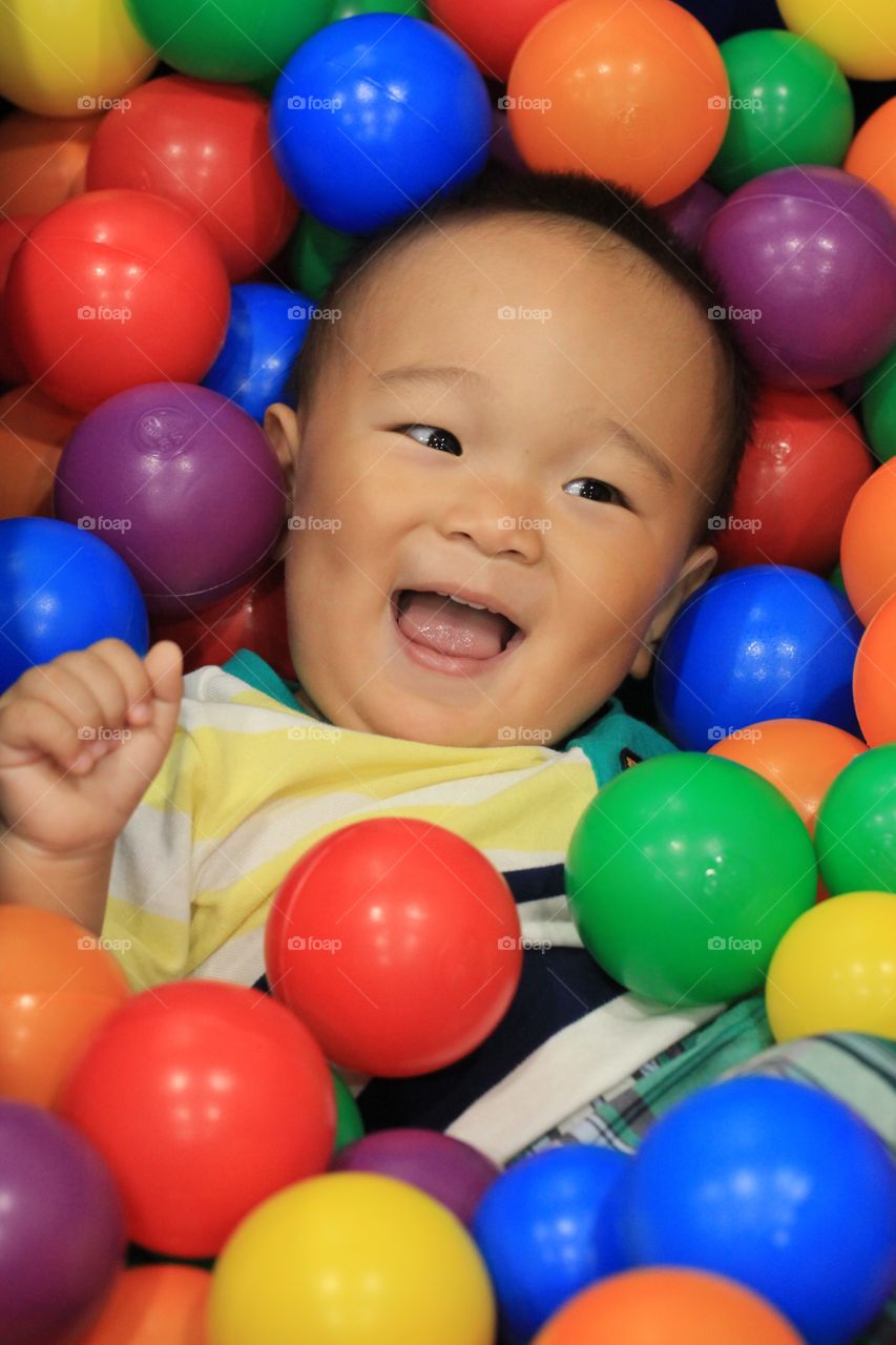 Boy with colorful balls