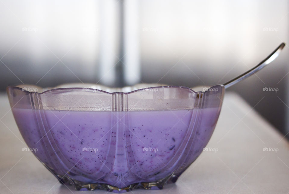 Side view of bowl with purple blueberry milk