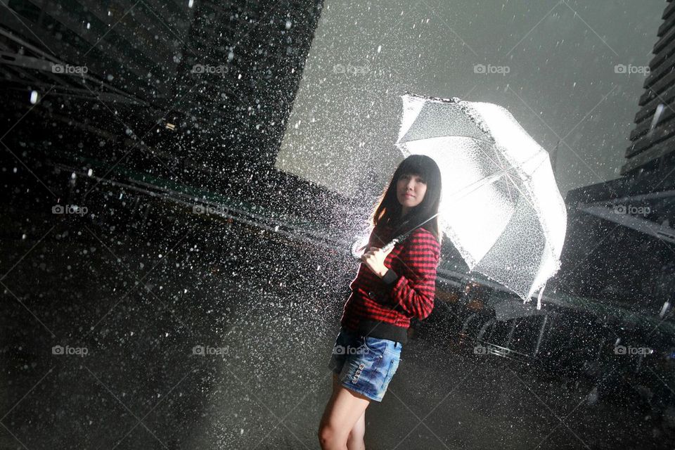 Red jacket girl under the rain