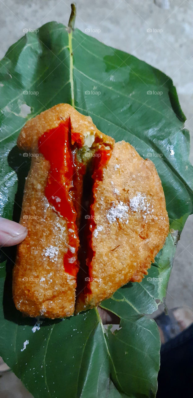 Captured a mouthwatering photo of a Bread pakoda,patato stuff inside with tomato ketchup.