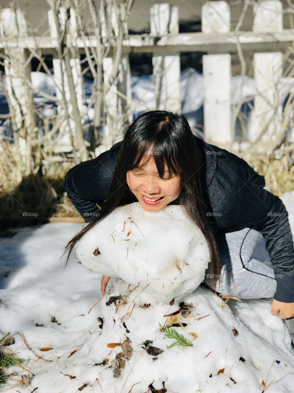 Lol mommy is trying to substitute her head on the snowman ☃️ 