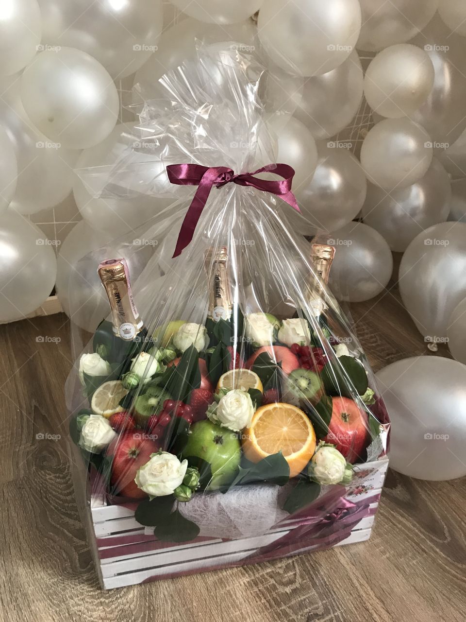 Beautiful gift bouquet with drinks and fruits