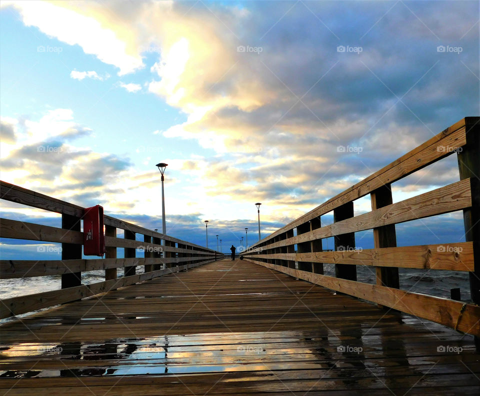 A fishing pier on a stunning golden hour