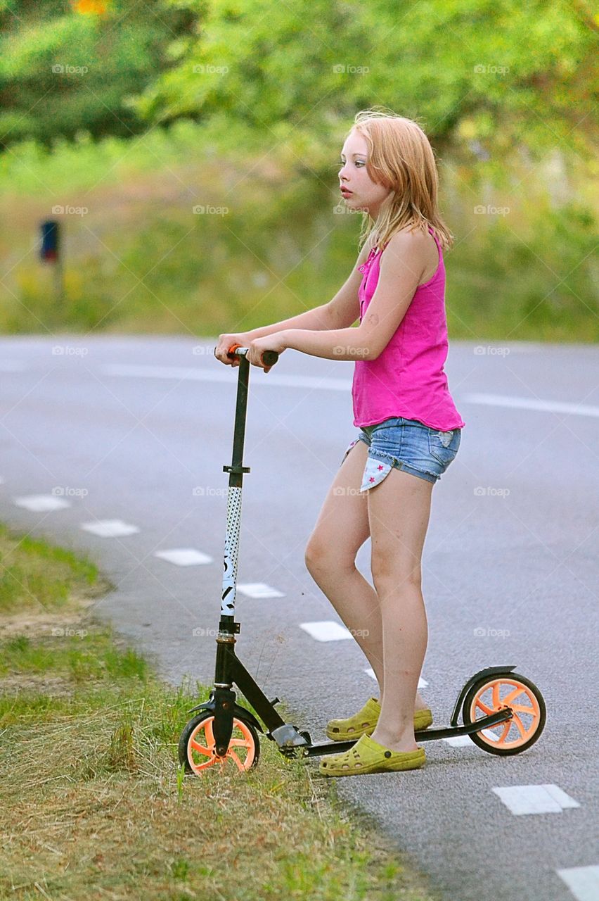 Girl on kickbike