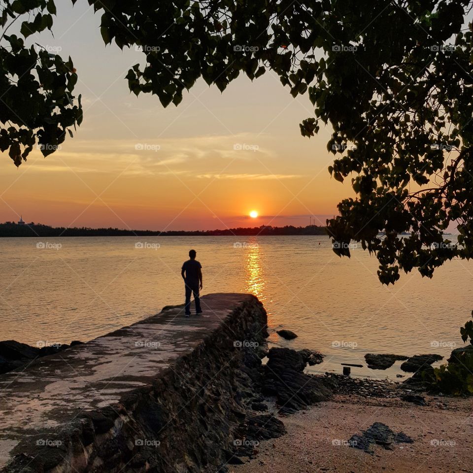 Scenic view  of sea against sunset sky