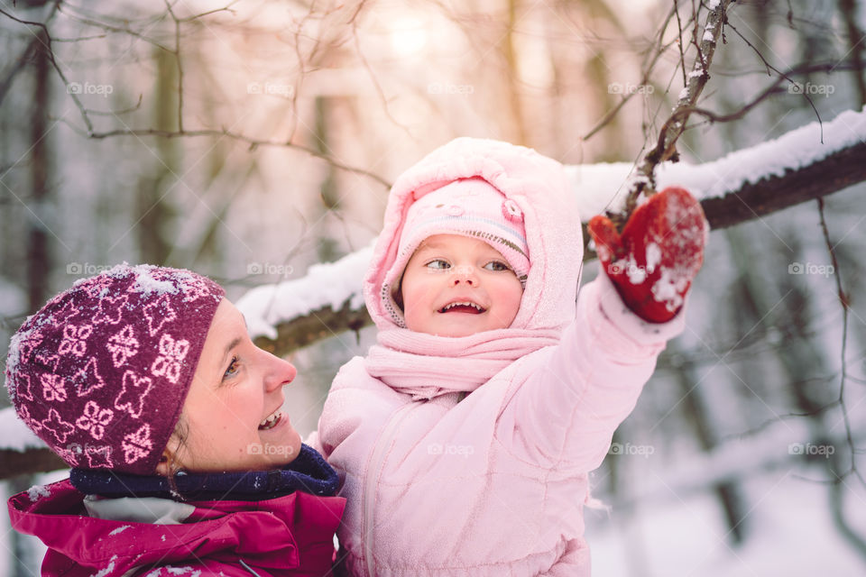 Winter with friends. Spending wintertime outdoors playing with snow