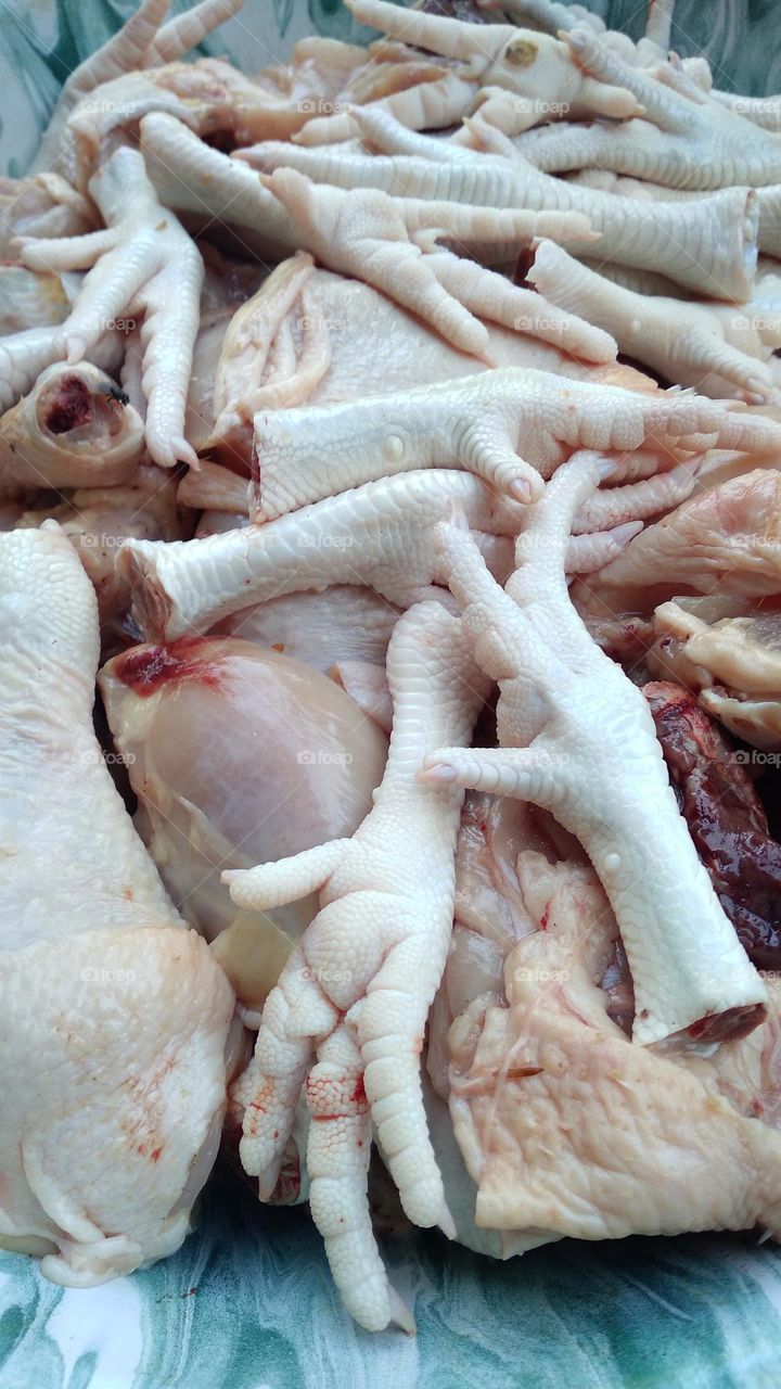 Chicken pieces that are ready to be processed for cooking