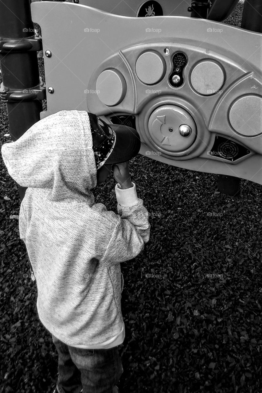 Hey little boy playing