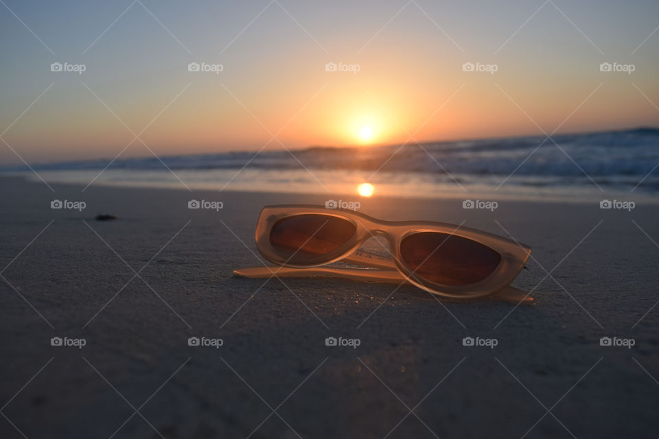 SunSet View & Sun Glasses By The Beach