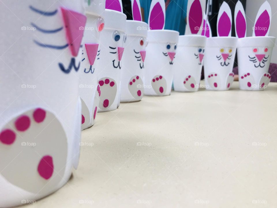 Styrofoam cup Easter bunnies all lined up in a row. 