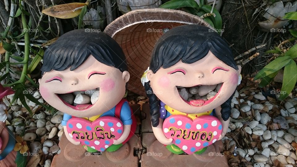 rock eating statues in Thailand
