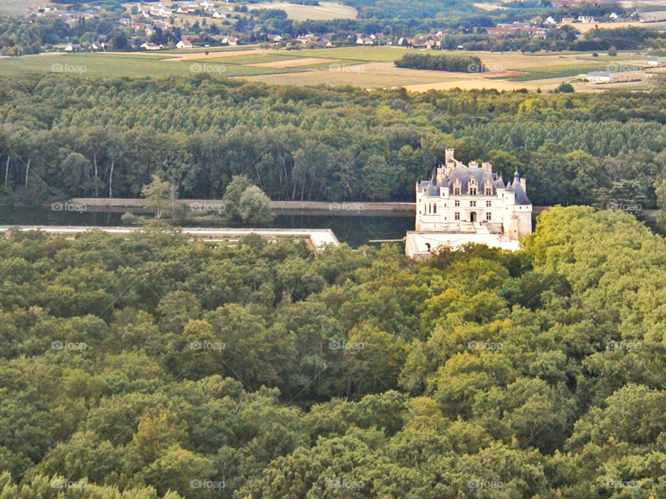 A French chateau in the forest. French château along the Loire river in France as seen from a hot air balloon 