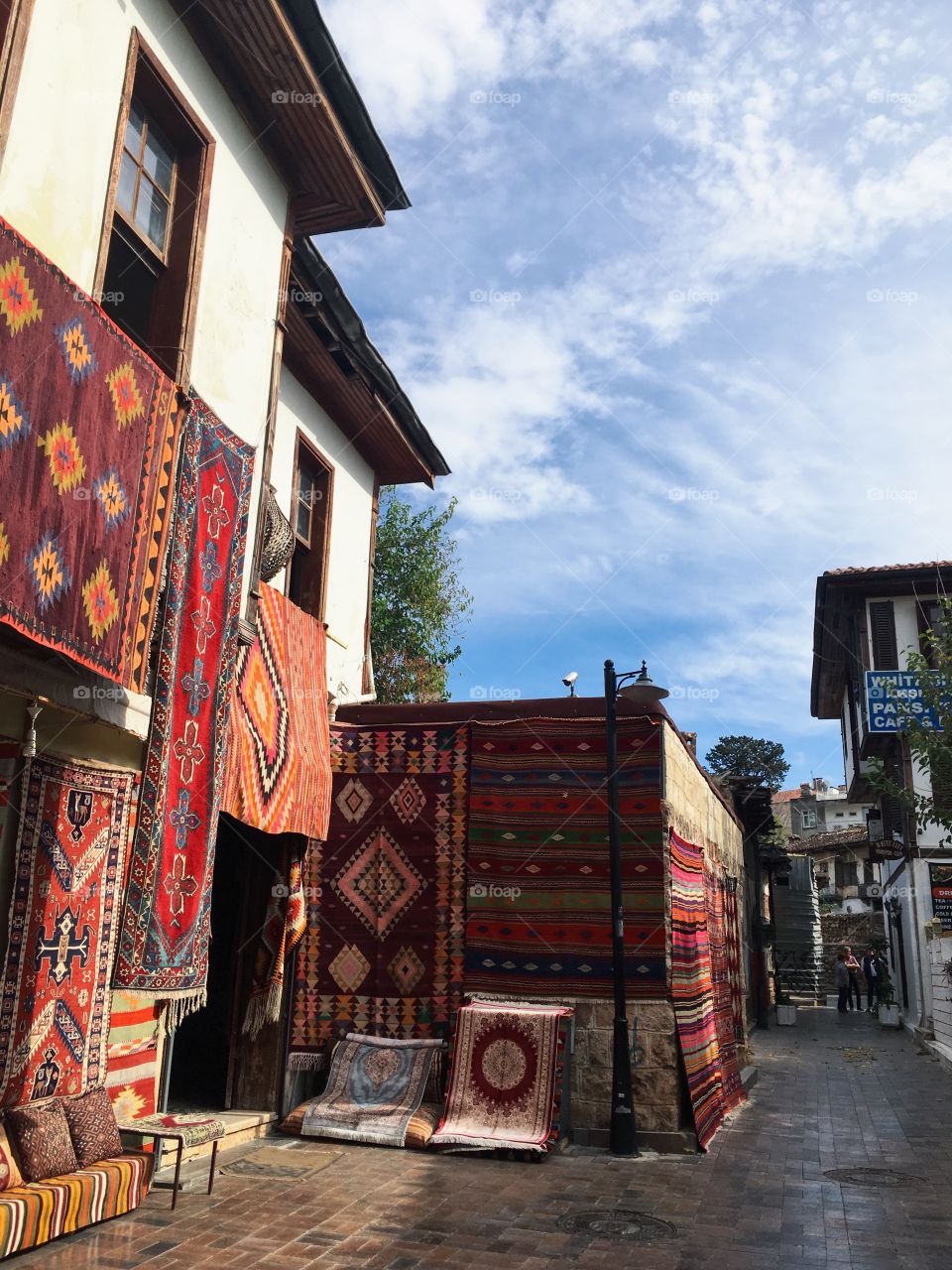 Selling Turkish carpets on the street in Antalya.
