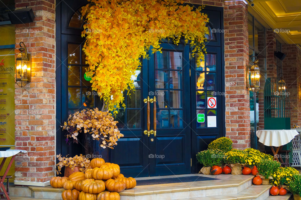 autumn decorations, pumpkins in front of the door