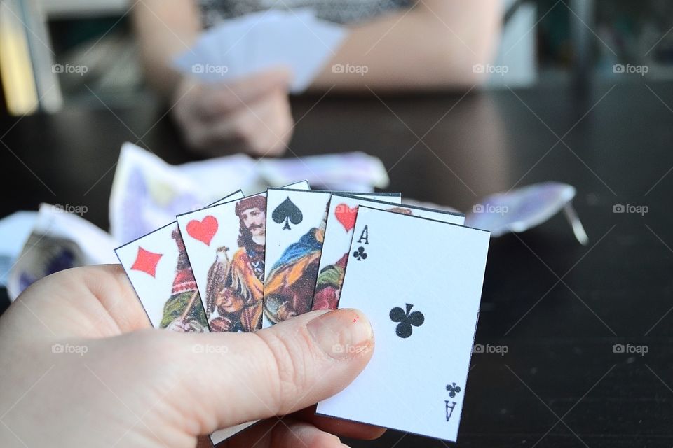 Close-up of hands playing poker