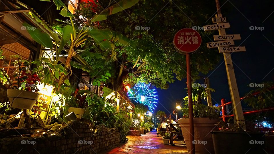 Night shot in American Village Okinawa Japan. It's a beautiful place and has plenty of shops, food and other cool little hideout stores. You'll probably hear good music while you walk around and meet nice people.