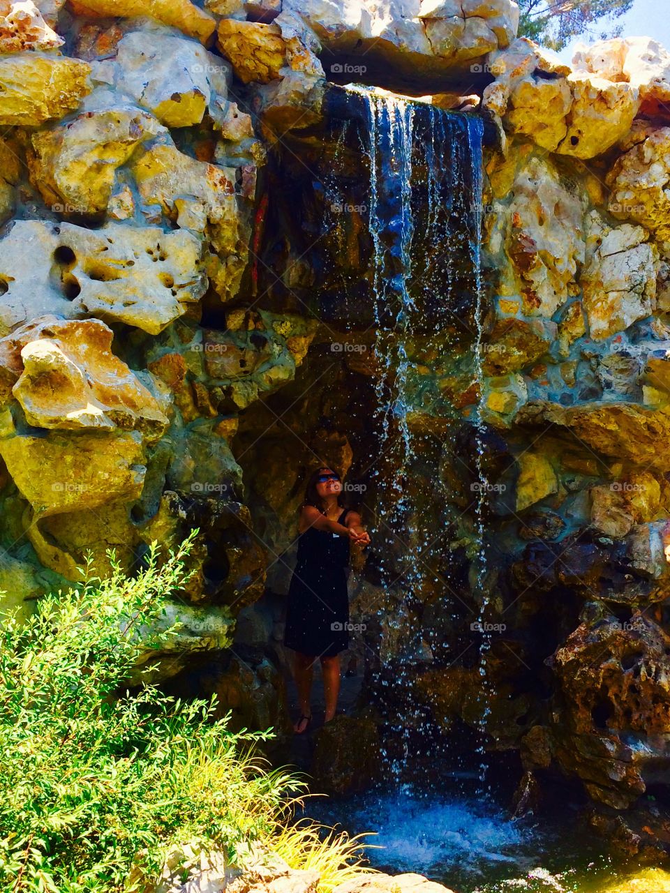 Close-up of girl standing waterfall