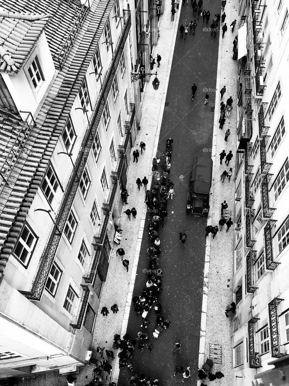 Aerial view of a central street in Lisbon with old palace architecture, black and white architecture 