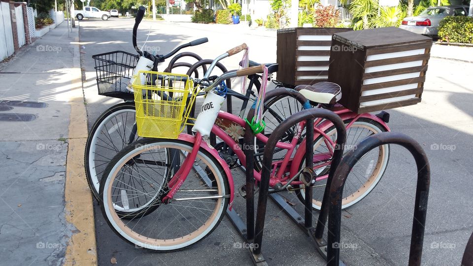 Pink Bike Yellow Basket. bicycling through Key West is  practical way to sightsee