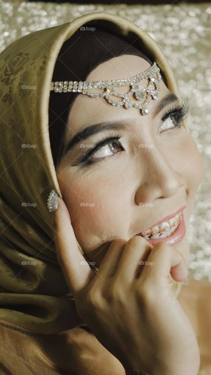 Portrait of a beautiful Asian woman with a happy smiling expression.