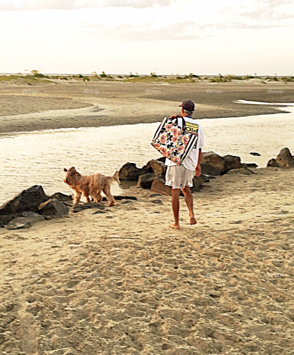 Man and his dog at the beach