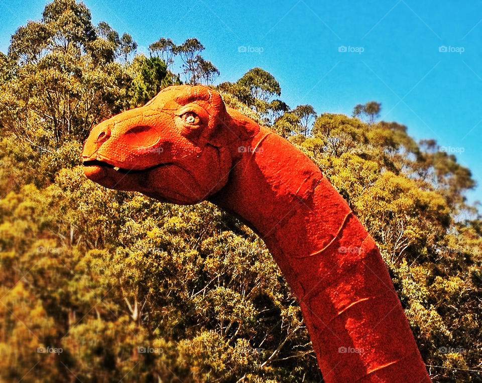 Rusting brontosaurus dinosaur statue