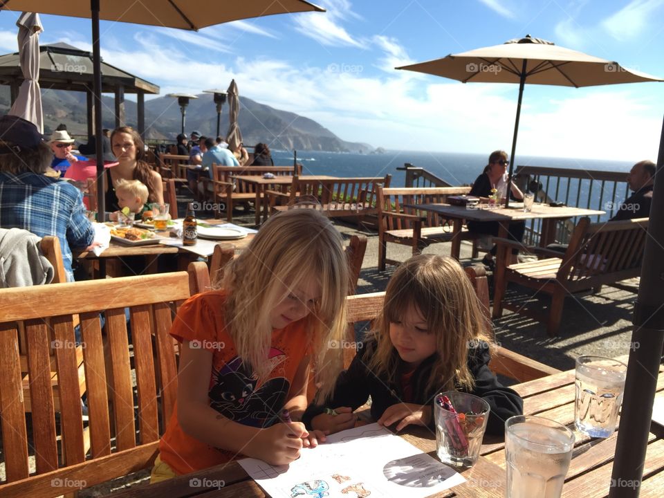 Two girl sketching on paper