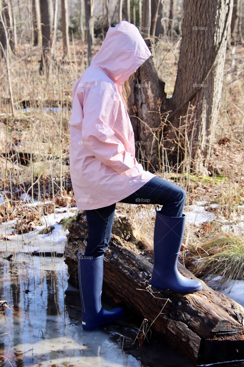 Woman wearing rain gear outdoors 