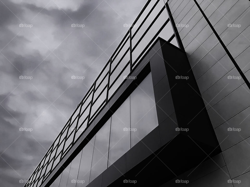 Black and white elements of exterior architecture decorated by windows and geometric pattern 