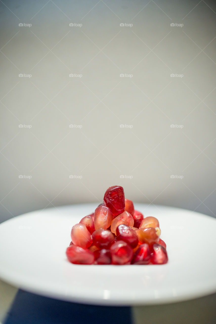 a small pyramid of pomegranate pearls